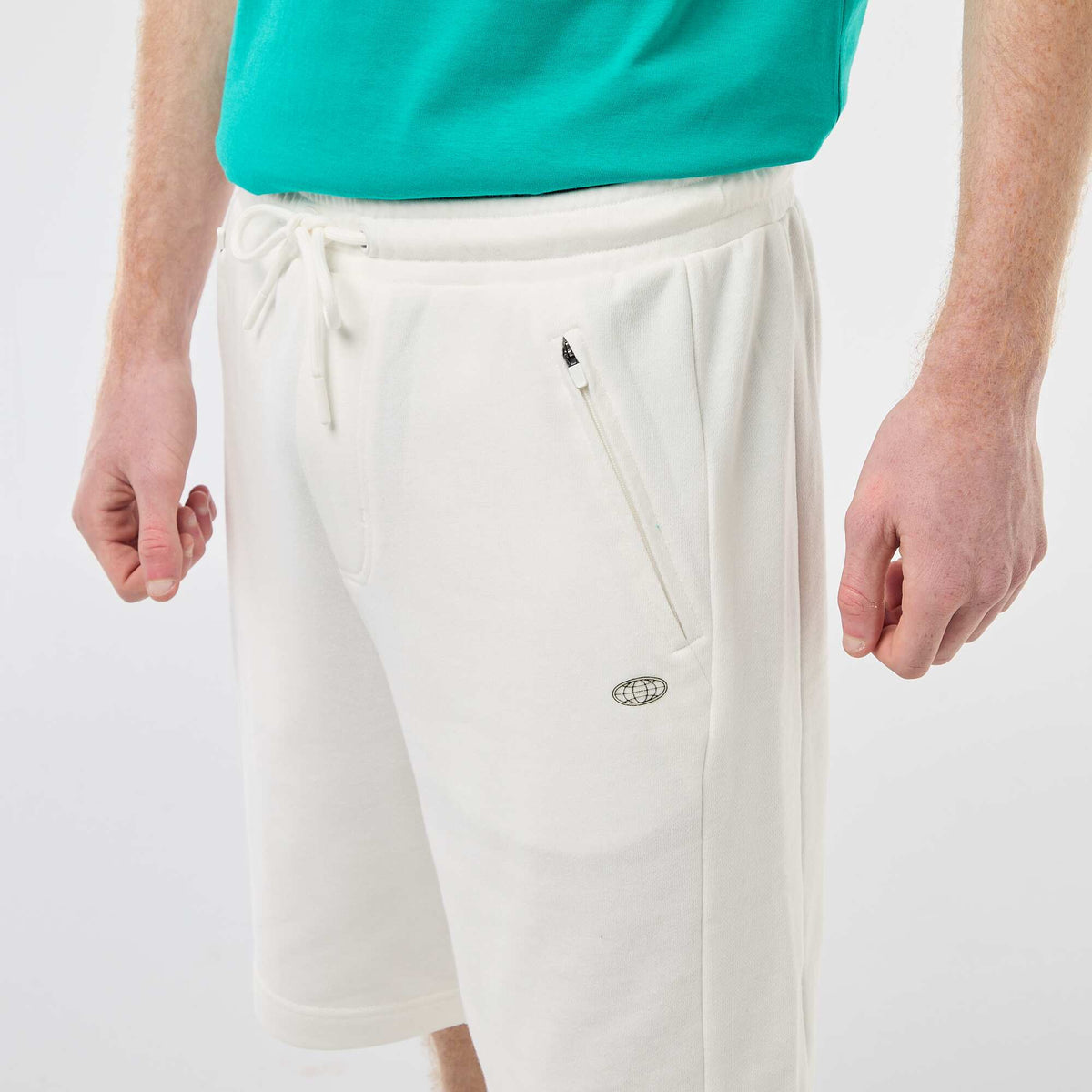 Short uni en french terry coton avec poches zippées BLANC